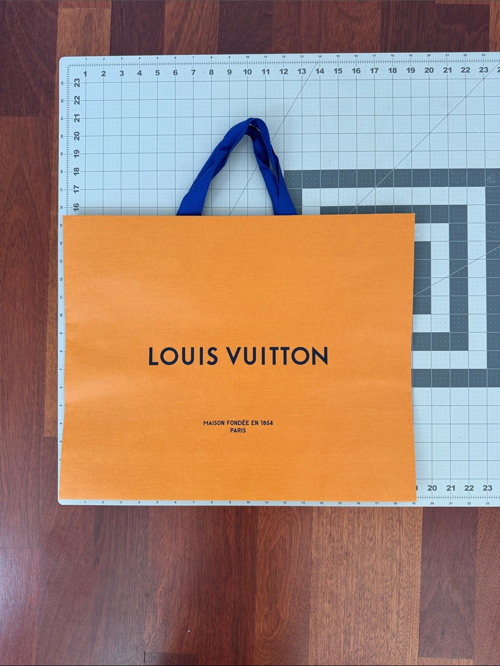 Louis Vuitton Orange Shopping Bag with Blue Handles